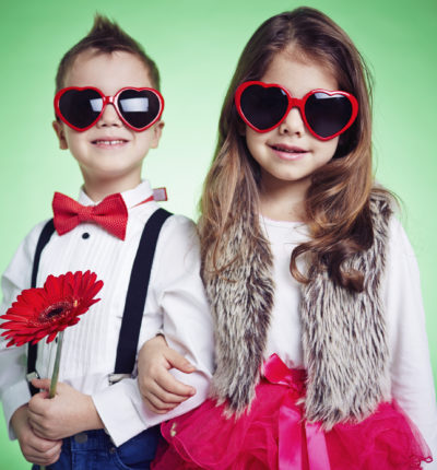 Portrait of stylish little friends in sunglasses